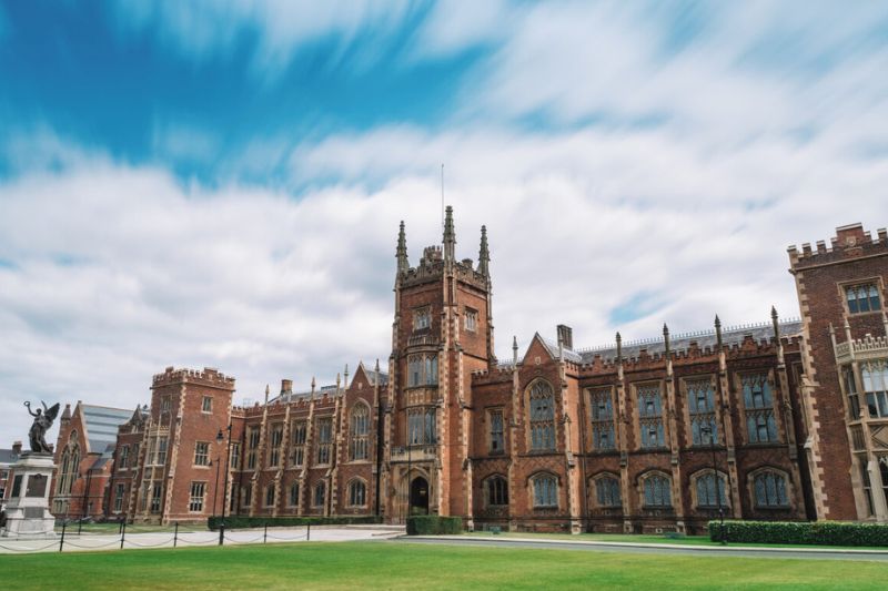 Front of QUB Lanyon building with blue and cloudy skies